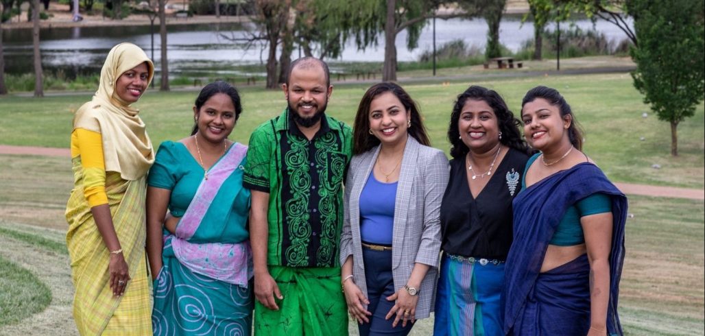 Sri Lankan women gather outdoors during a research-to-policy programme