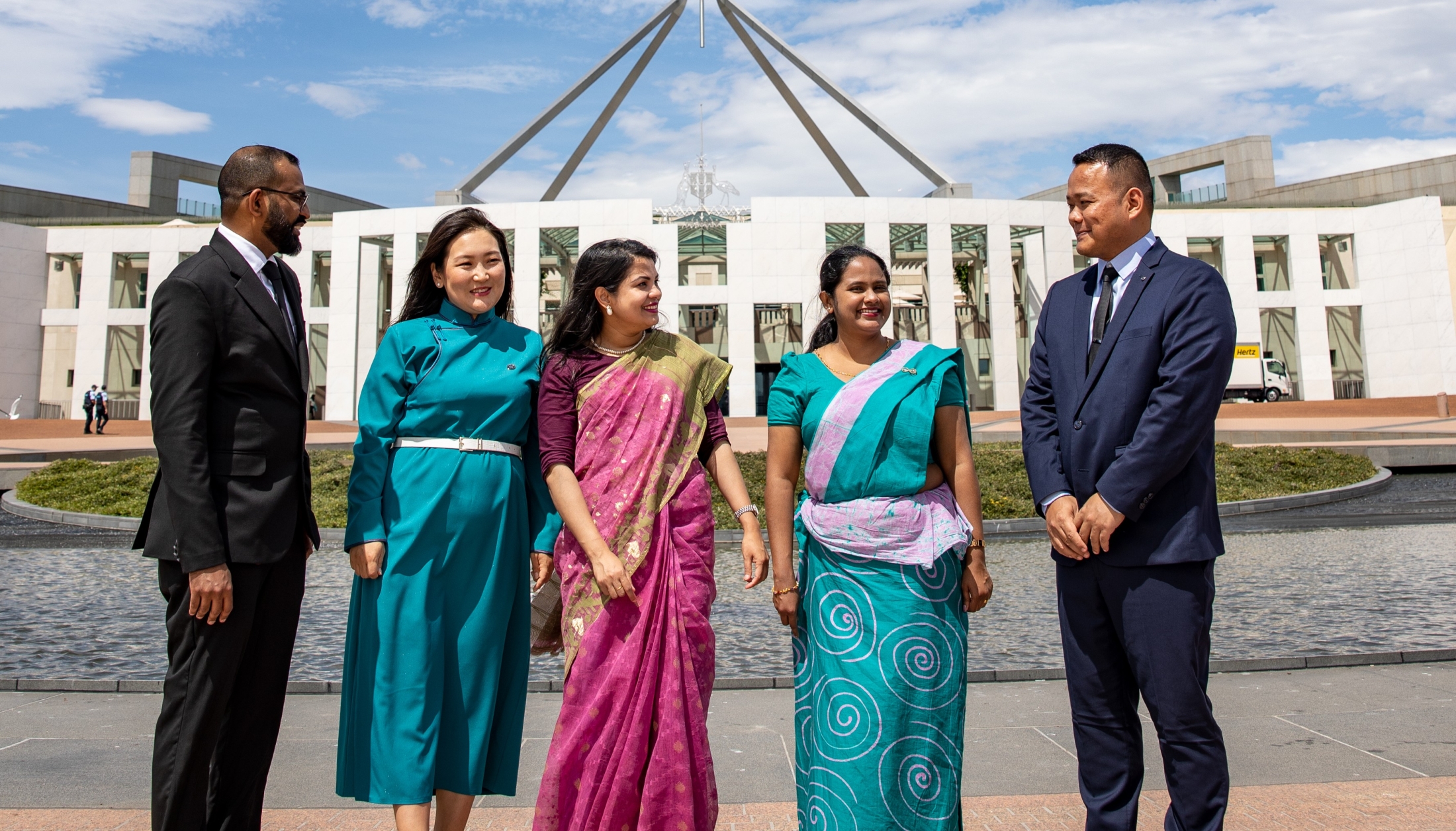 Image of Gayathri (second from right) pictured with other scholars from South Asia and Mongolia in front of the Parliament House in Canberra during the 2024 Scholars Forum.