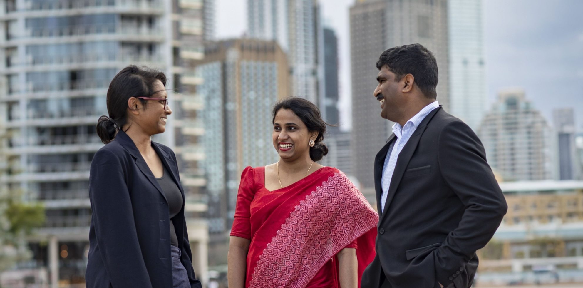 Three Sri Lankan Australia Awards scholars stand together in Melbourne